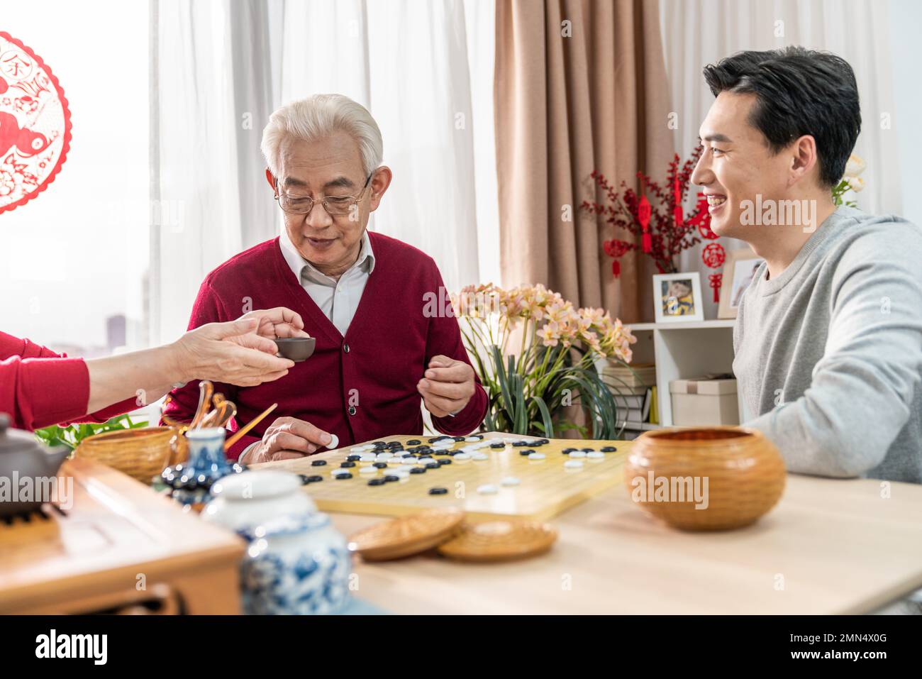 Happy family go over a cup of tea Stock Photo - Alamy