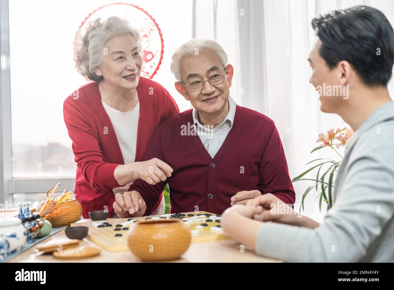 Happy family go over a cup of tea Stock Photo - Alamy
