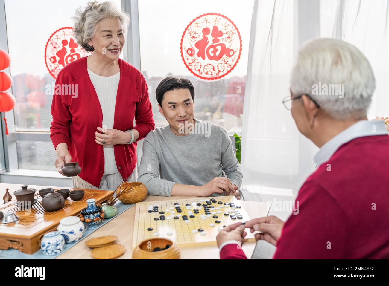 Happy family go over a cup of tea Stock Photo - Alamy