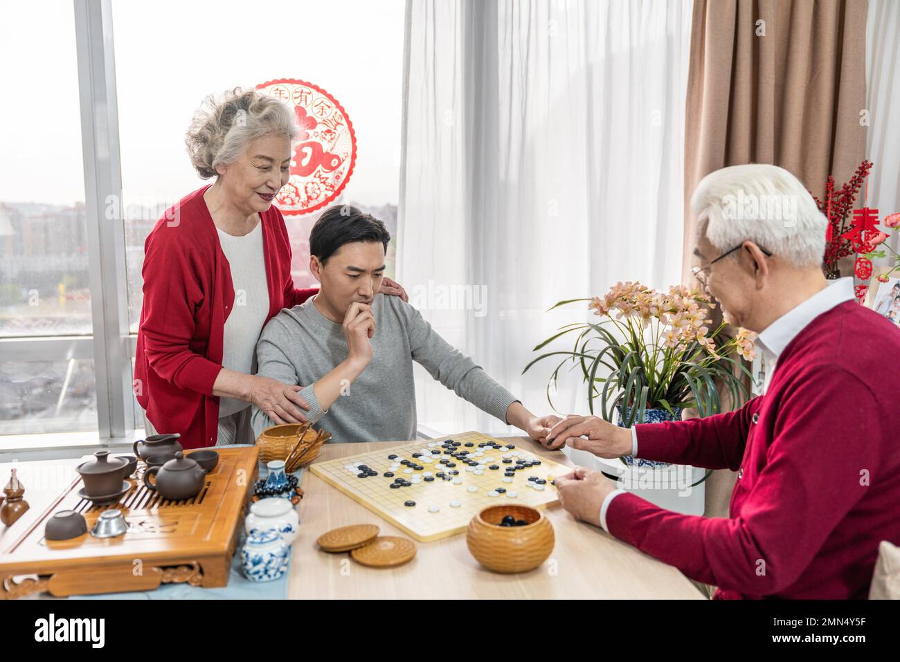 Happy family go over a cup of tea Stock Photo - Alamy