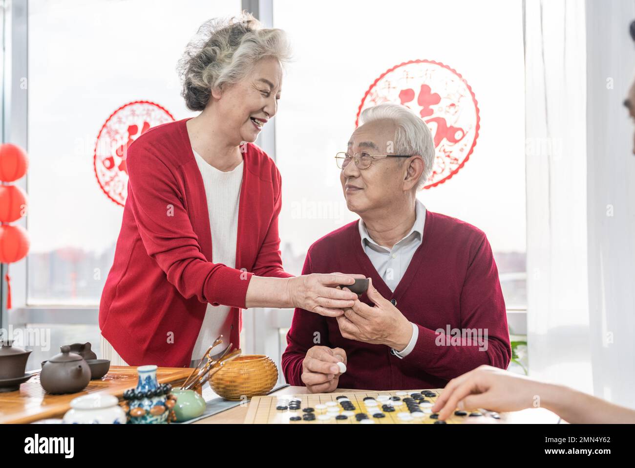 Happy family go over a cup of tea Stock Photo - Alamy