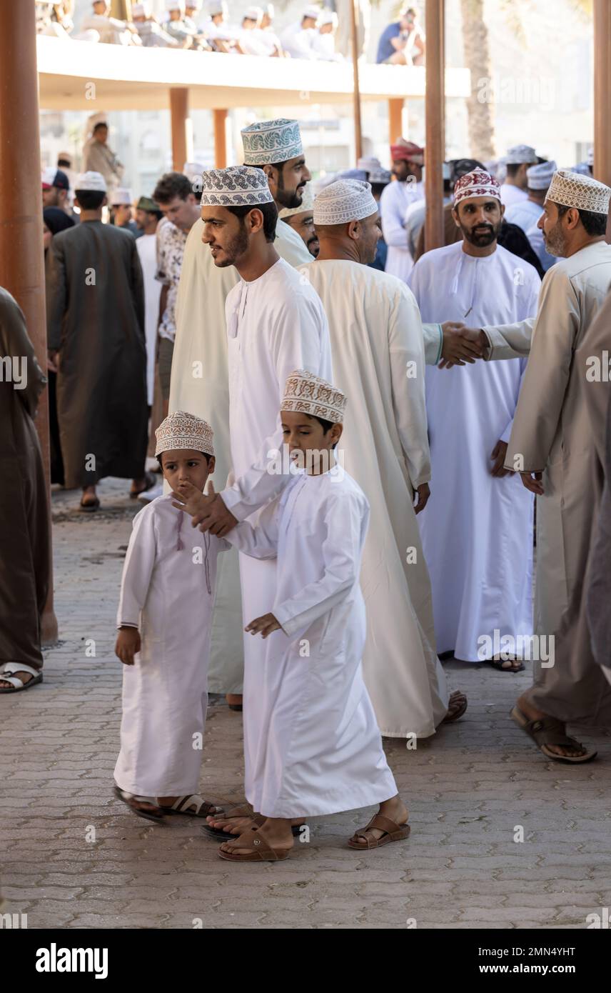 Nizwa, Oman, 2nd December 2022: Omani man with his sons in a