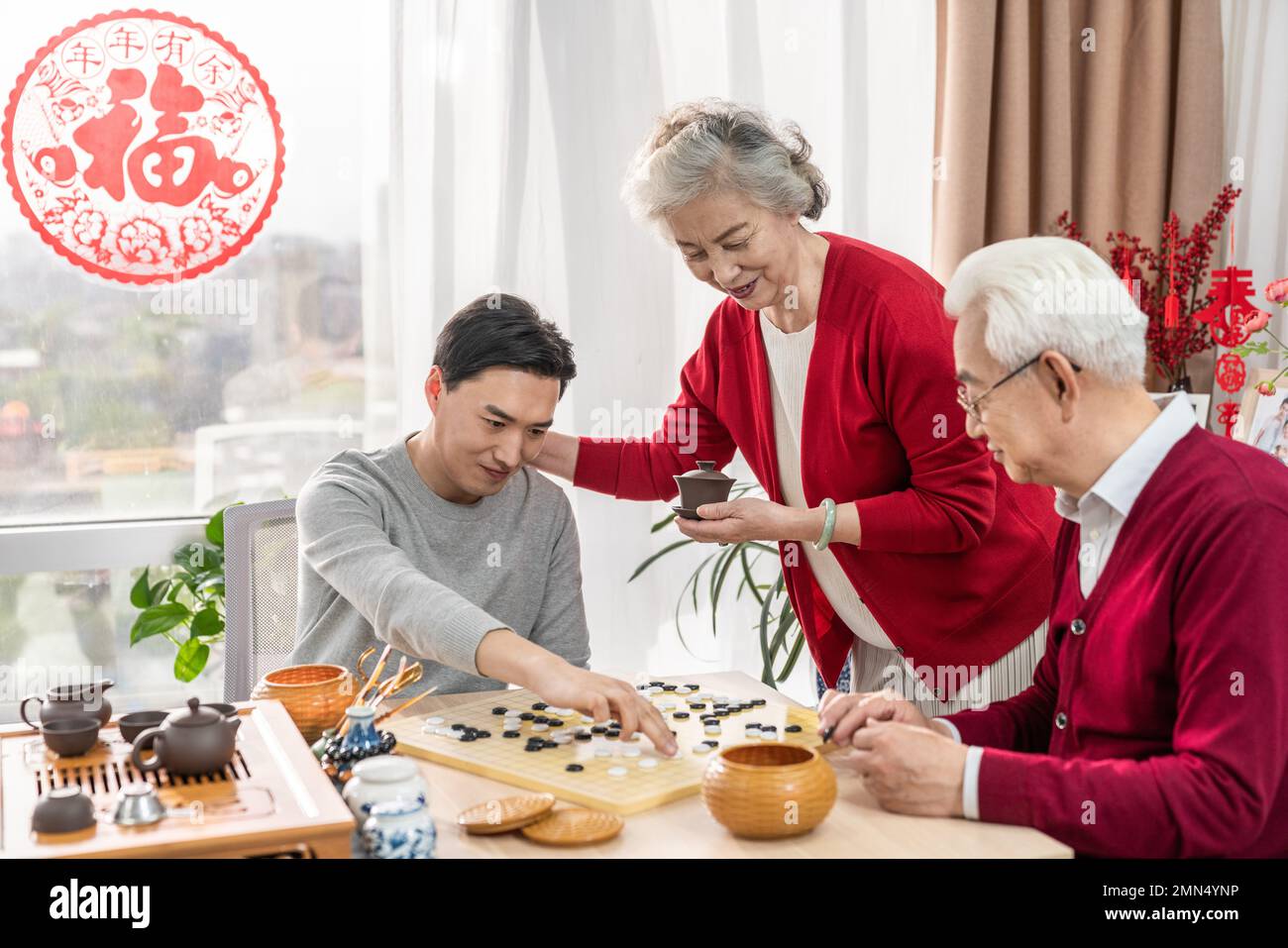 Happy family go over a cup of tea Stock Photo - Alamy