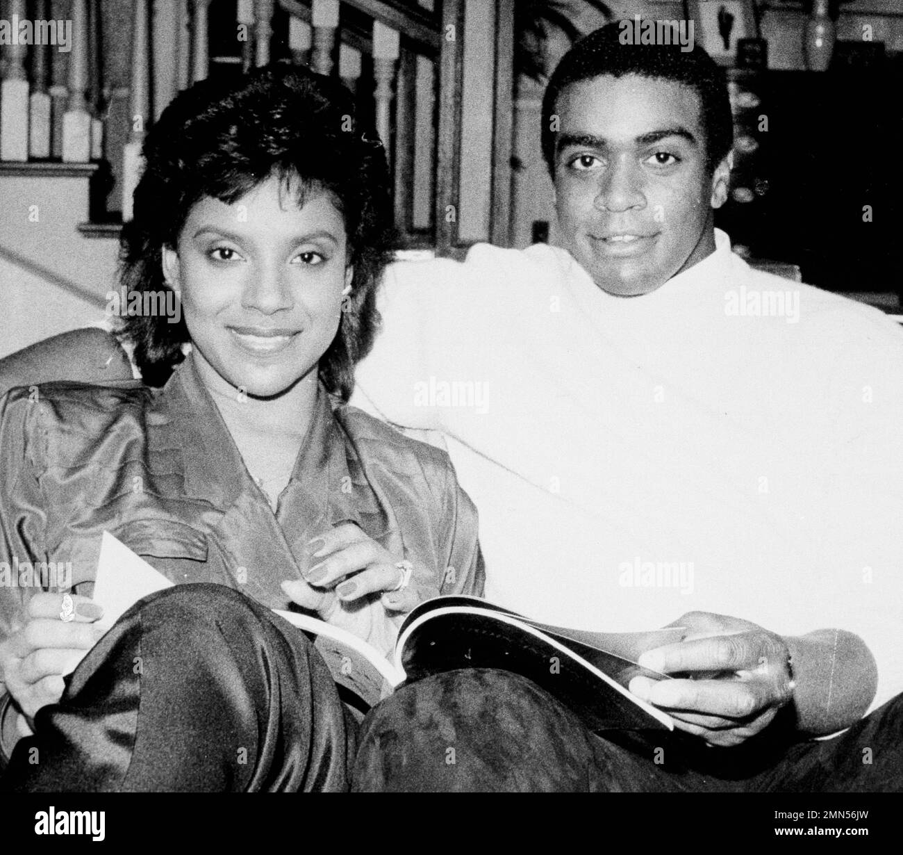 Profootball star Ahmad Rashad sits with his girlfriend Phylicia Ayers