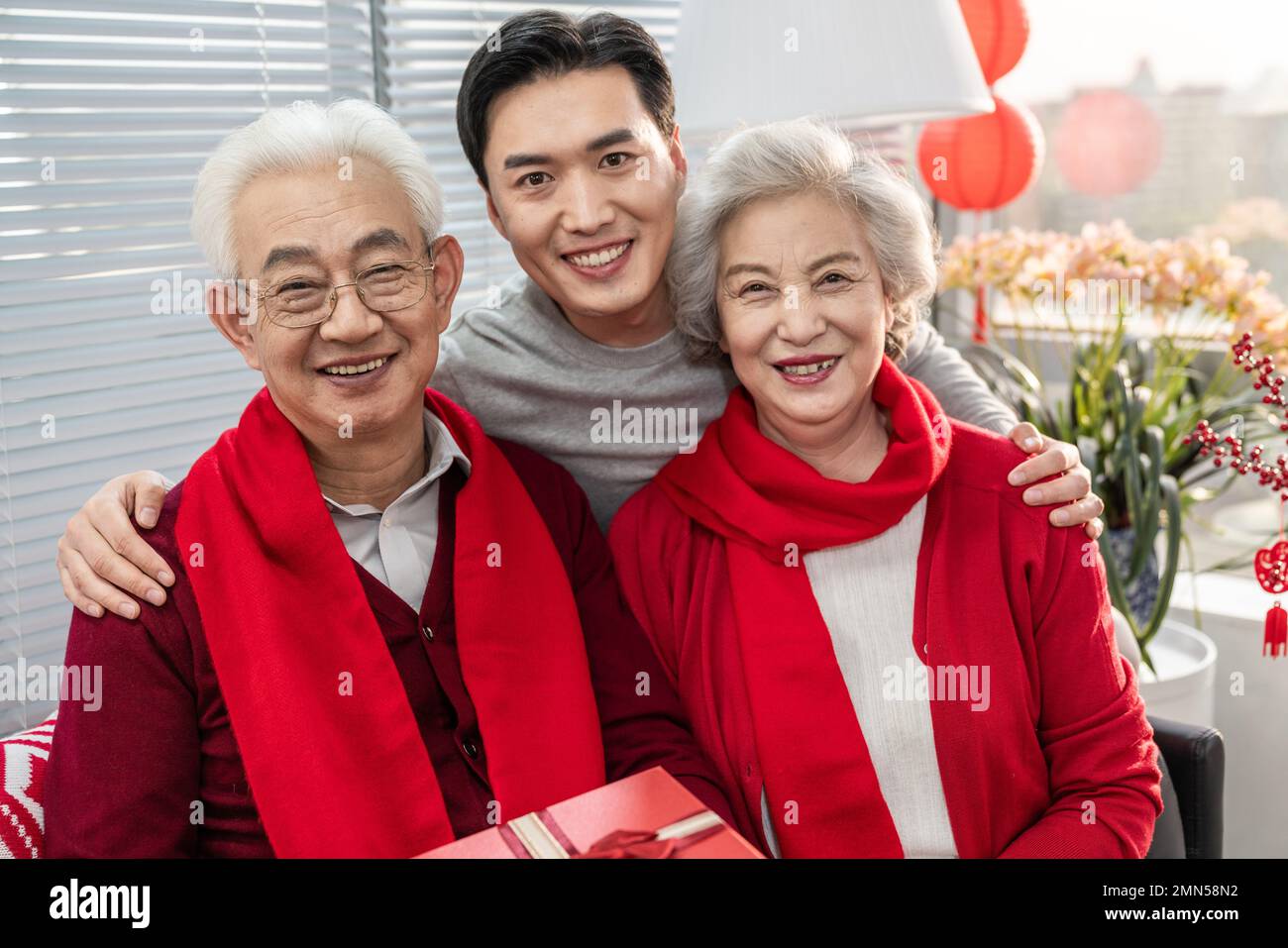 Happy family standing in spring hi-res stock photography and images - Alamy