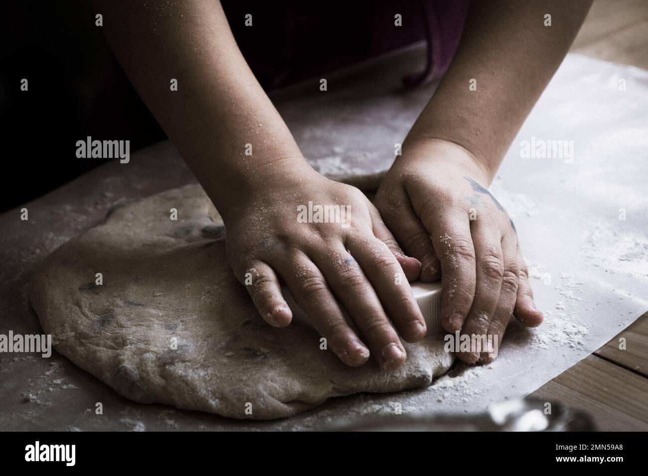 Child Kneading Bread Dough on a floured surface Stock Photo Alamy