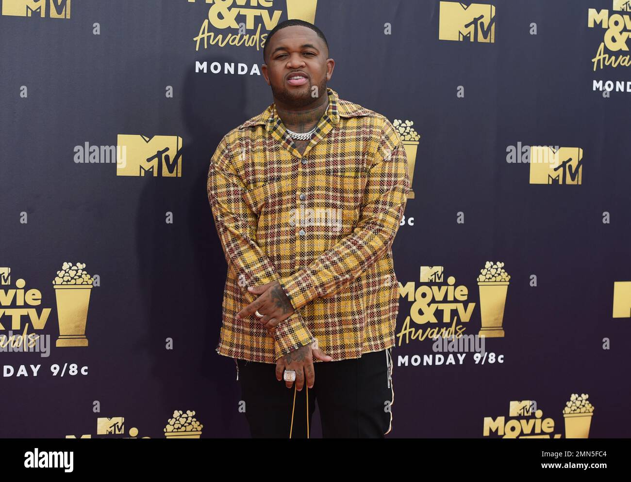 DJ Mustard arrives at the MTV Movie and TV Awards at the Barker Hangar