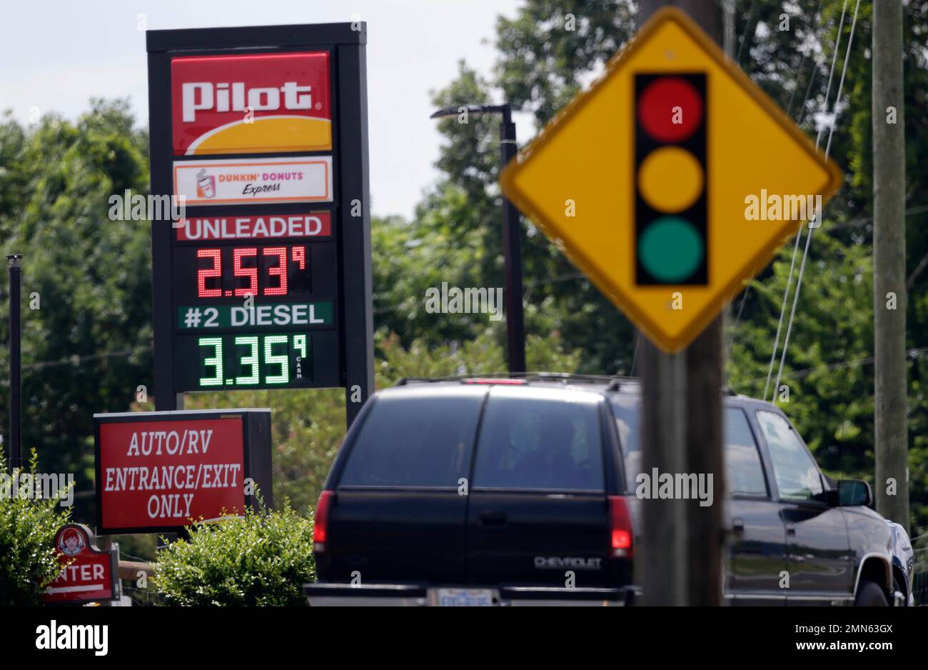 In this photo taken Thursday, June 14, 2018 an automobile drives past