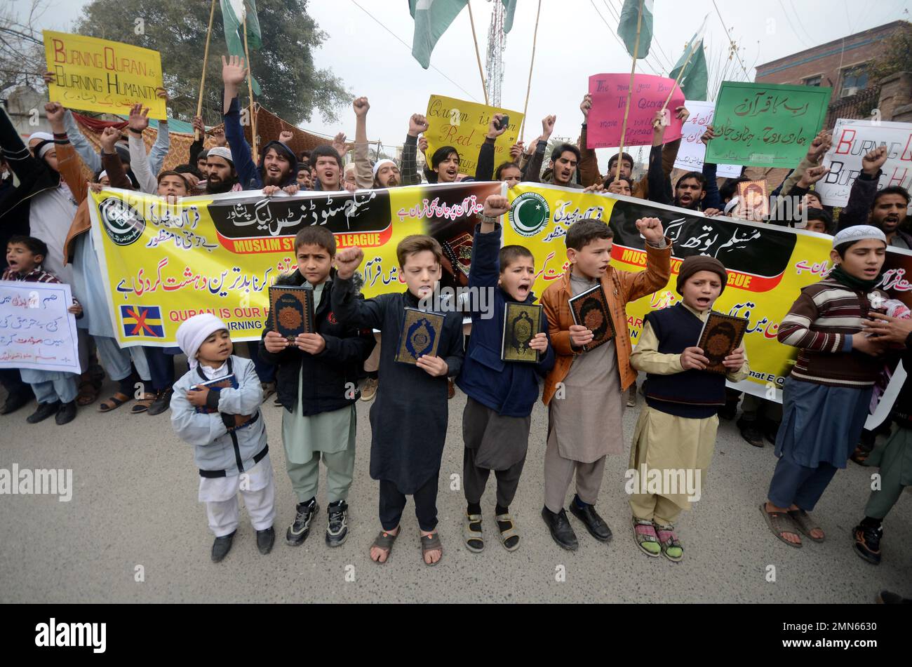Peshawar, Pakistan. 29th Jan, 2023. Supporters of Muslim Man's League party hold a placard reading in Urdu 'Burning of the Koran is the worst type of terrorism by Sweden' during a protest against Sweden in Peshawar, Pakistan on Jan. 29, 2023. Pakistani Prime Minister Shahbaz Sharif, several Arab countries as well as Turkey condemned on 23 January, Islamophobia after Swedish-Danish far-right politician Rasmus Paludan burned a copy of the Koran at a rally in Stockholm on 21 January. (Photo by Hussain Ali/Pacific Press/Sipa USA) Credit: Sipa USA/Alamy Live News Stock Photo