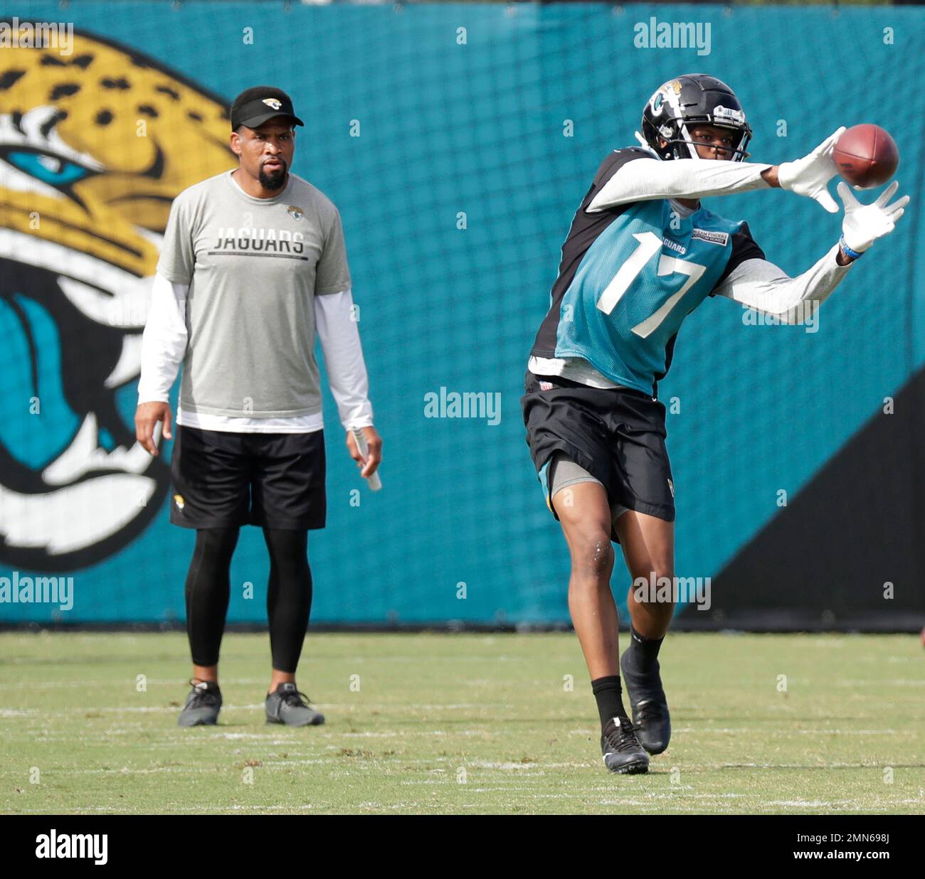 Jacksonville Jaguars wide receivers coach Keenan McCardell, left