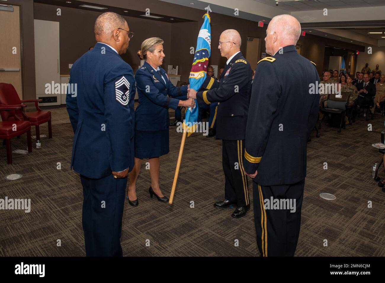 U.S. Air Force Maj. Gen. Shanna Woyak, left, outgoing director, Small Market and Stand Alone