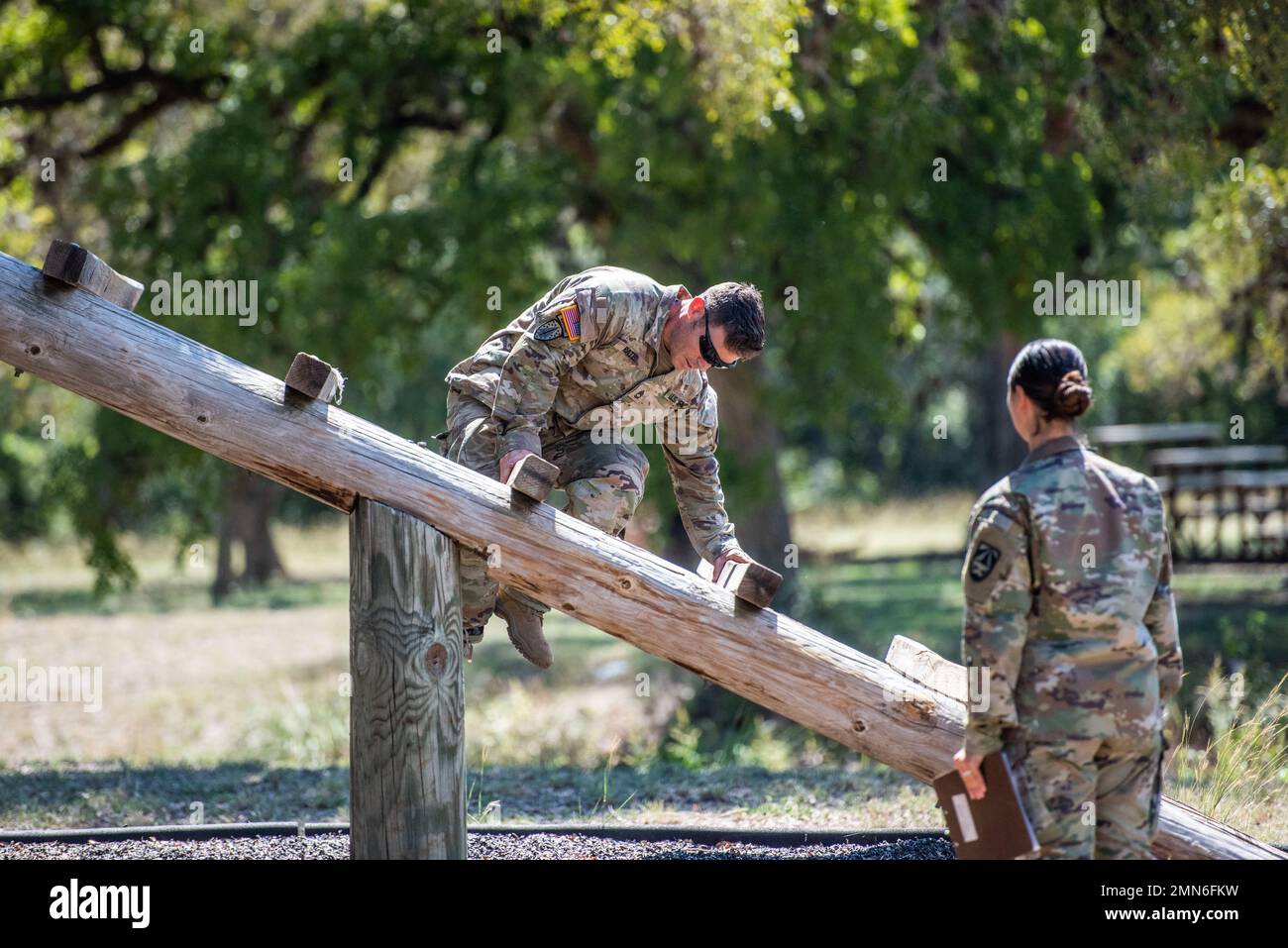 Sergeant 1st Class Jason E. Pate, 68W Combat Medics, 187th Medical Battalion, navigates the Weaver obstacle during the best medic competition, Sep. 29, 2022 at Joint Base San Antonio-Camp Bullis, Tx. The event included the Army Combat Fitness Test, obstacle course, M-4 qualification, warrior tasks and battle drills, land navigation, a Tactical Combat Casualty Care assessment and 12-Mile Ruck March. Stock Photo