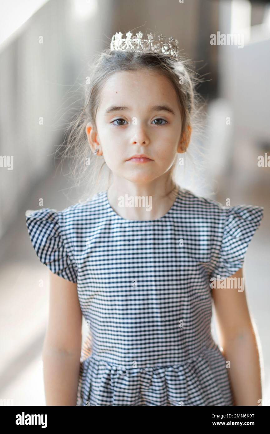 Smiling little school girl crown hi-res stock photography and images ...