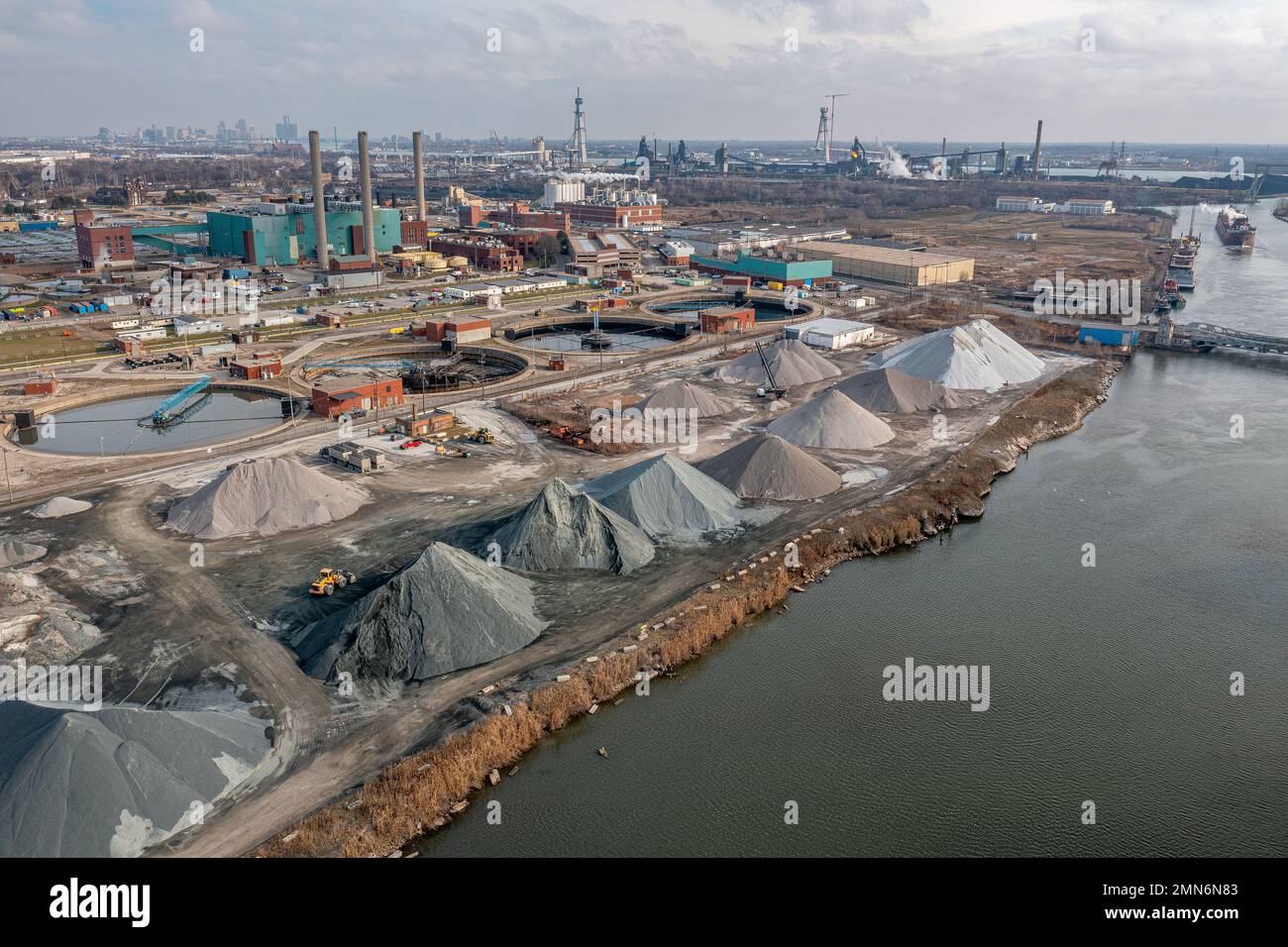 Aerial view of primary clarifiers at Detroit Wastewater and Sewage Treatment Plant and Levy Aggregates on the Rouge River, Michigan, USA Stock Photo