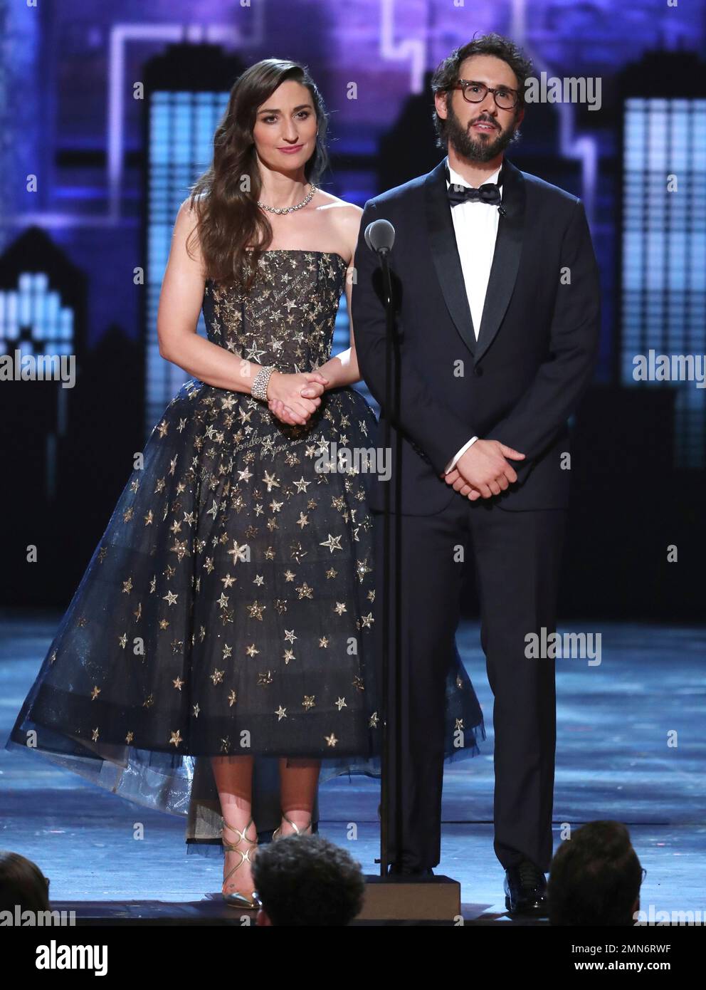 Cohosts Sara Bareilles, left, and Josh Groban appear on stage at the