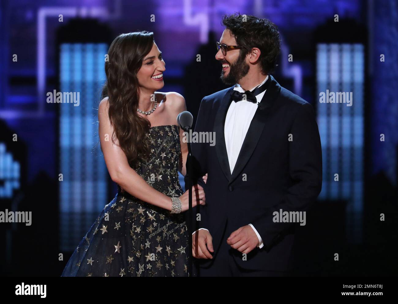 Cohosts Sara Bareilles, left, and Josh Groban, speak on stage at the