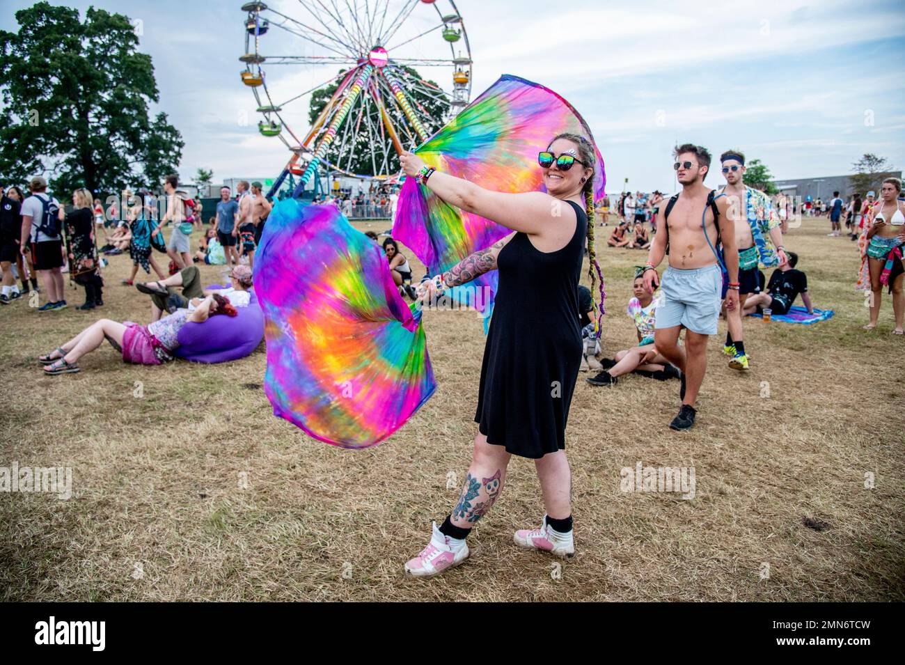 Festival goers attend at the Bonnaroo Music and Arts Festival on Sunday ...