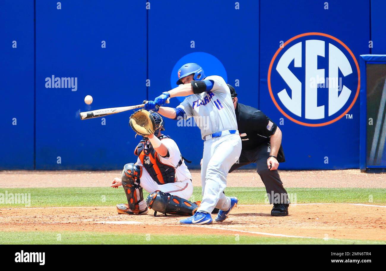 Florida catcher Jonah Girand flies out against Auburn during an NCAA