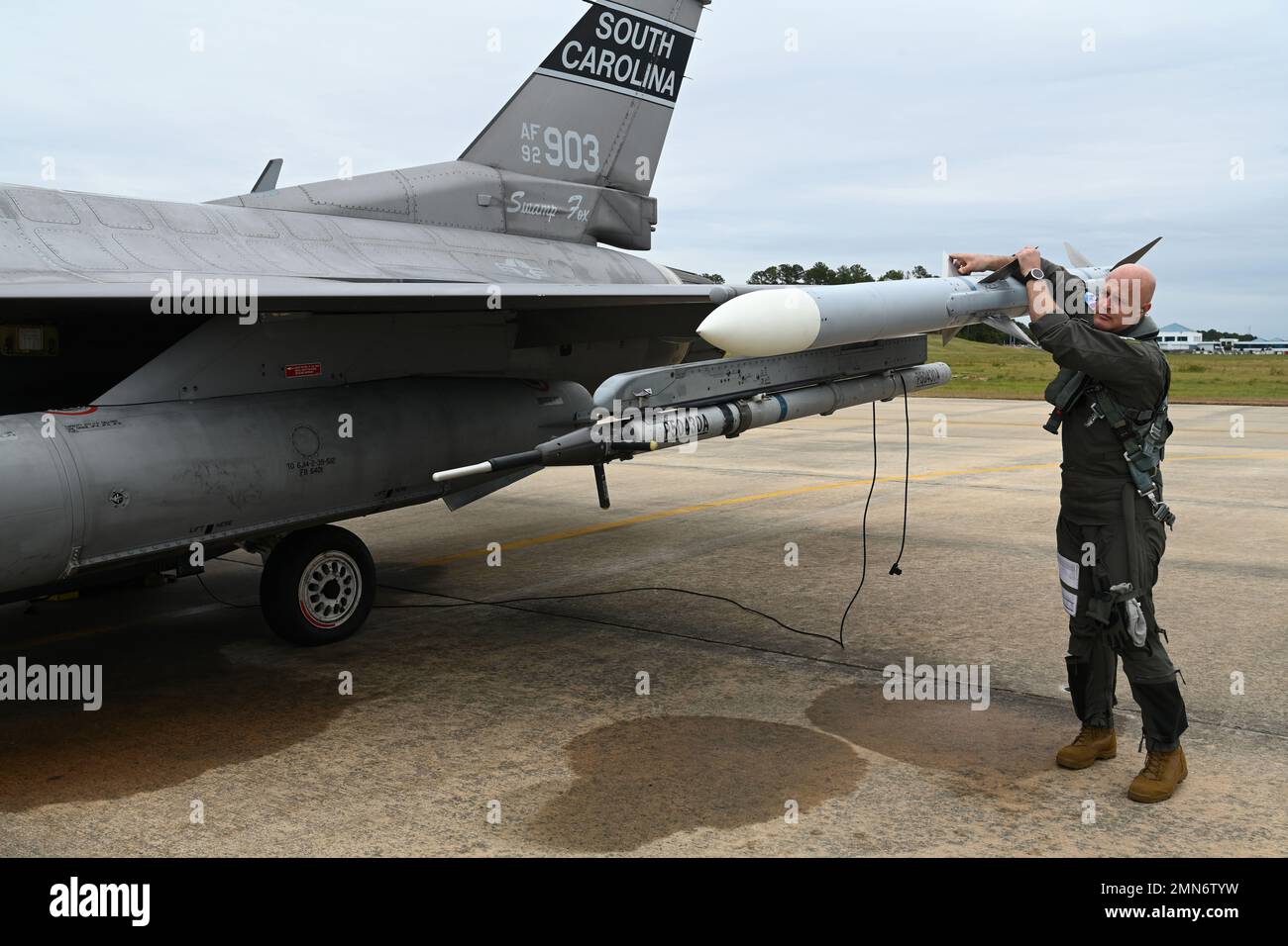 U.S. Air Force Lt. Col. David Anderson, 157th Fighter Squadron pilot, prepares a F-16 fighter jet from the South Carolina Air National Guard’s 169th Fighter Wing to depart Columbia Metropolitan Airport in West Columbia, South Carolina to an alternate airfield September 29, 2022. The temporary relocation is a safety precaution ahead of the anticipated arrival of Hurricane Ian. The aircraft will return to South Carolina and resume their normal flight training operations just as soon as conditions allow. Stock Photo