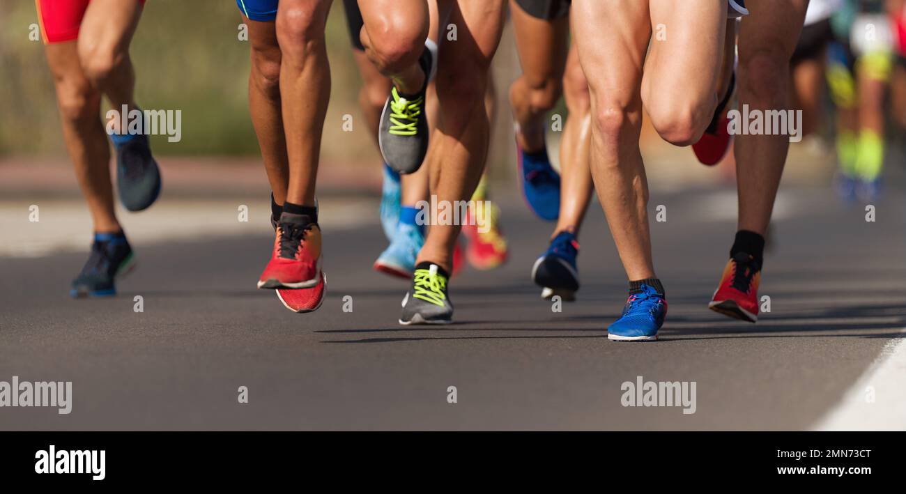 Marathon running race, people feet on city road Stock Photo - Alamy