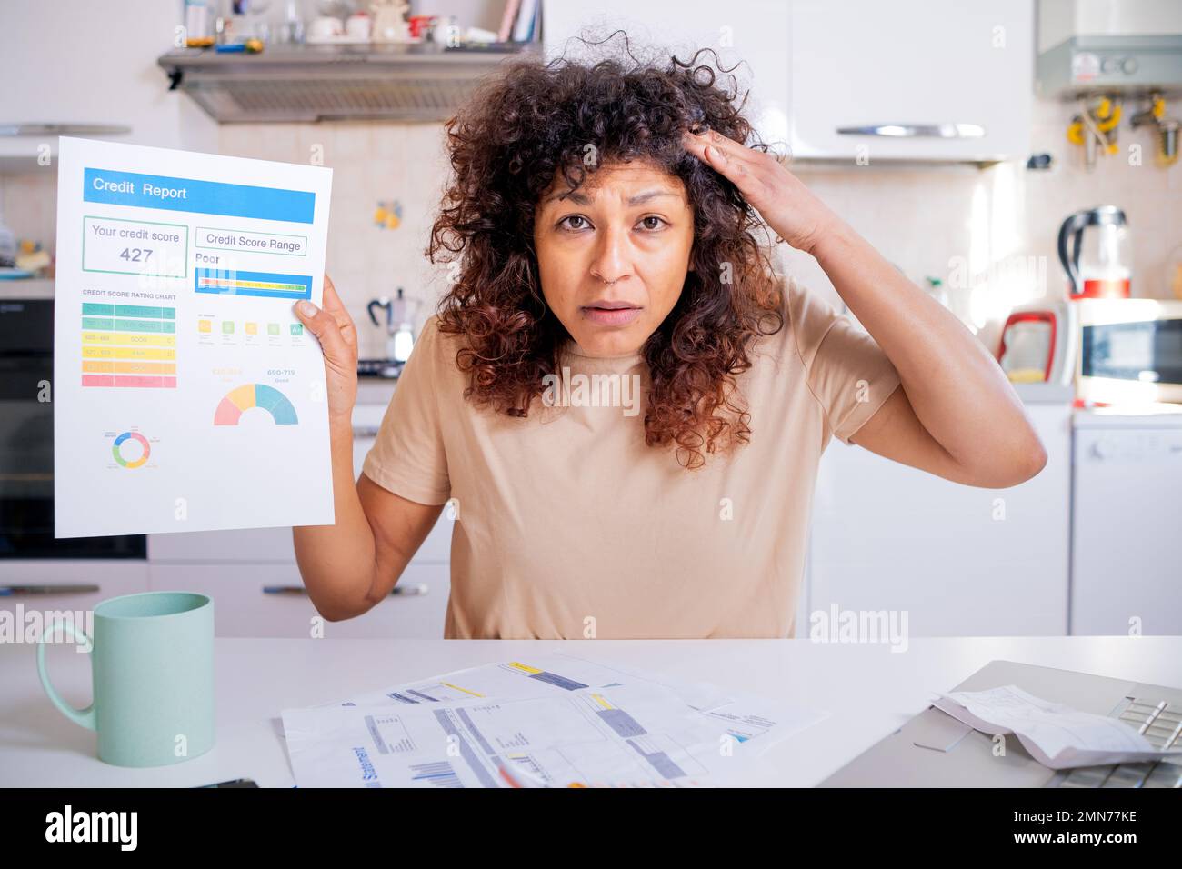 Black woman worried about bank low credit score statement Stock Photo