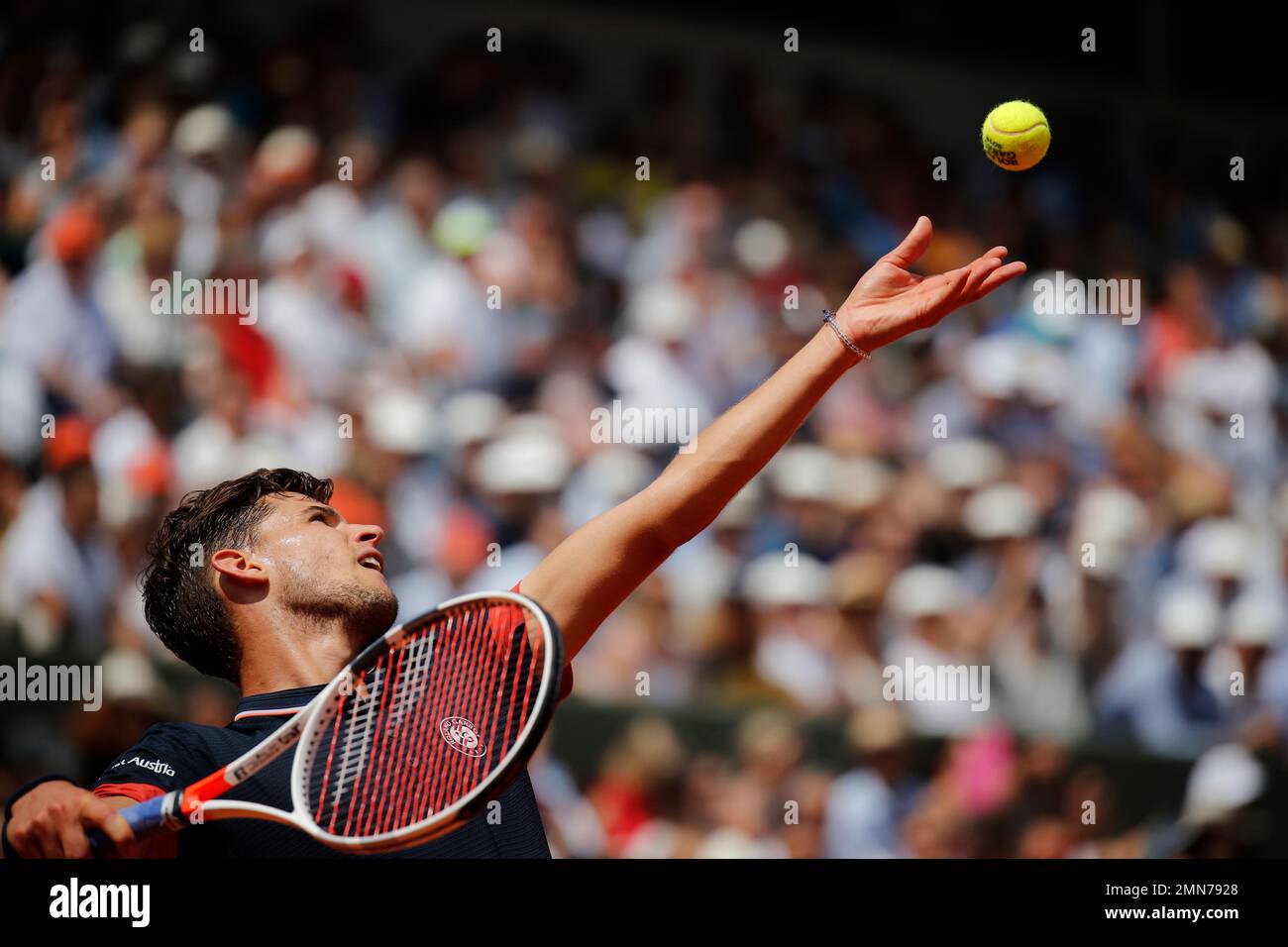 Austrias Dominic Thiem serves against Italys Marco Cecchinato during their semifinal match of the French Open tennis tournament at the Roland Garros stadium in Paris, France, Friday, June 8, 2018
