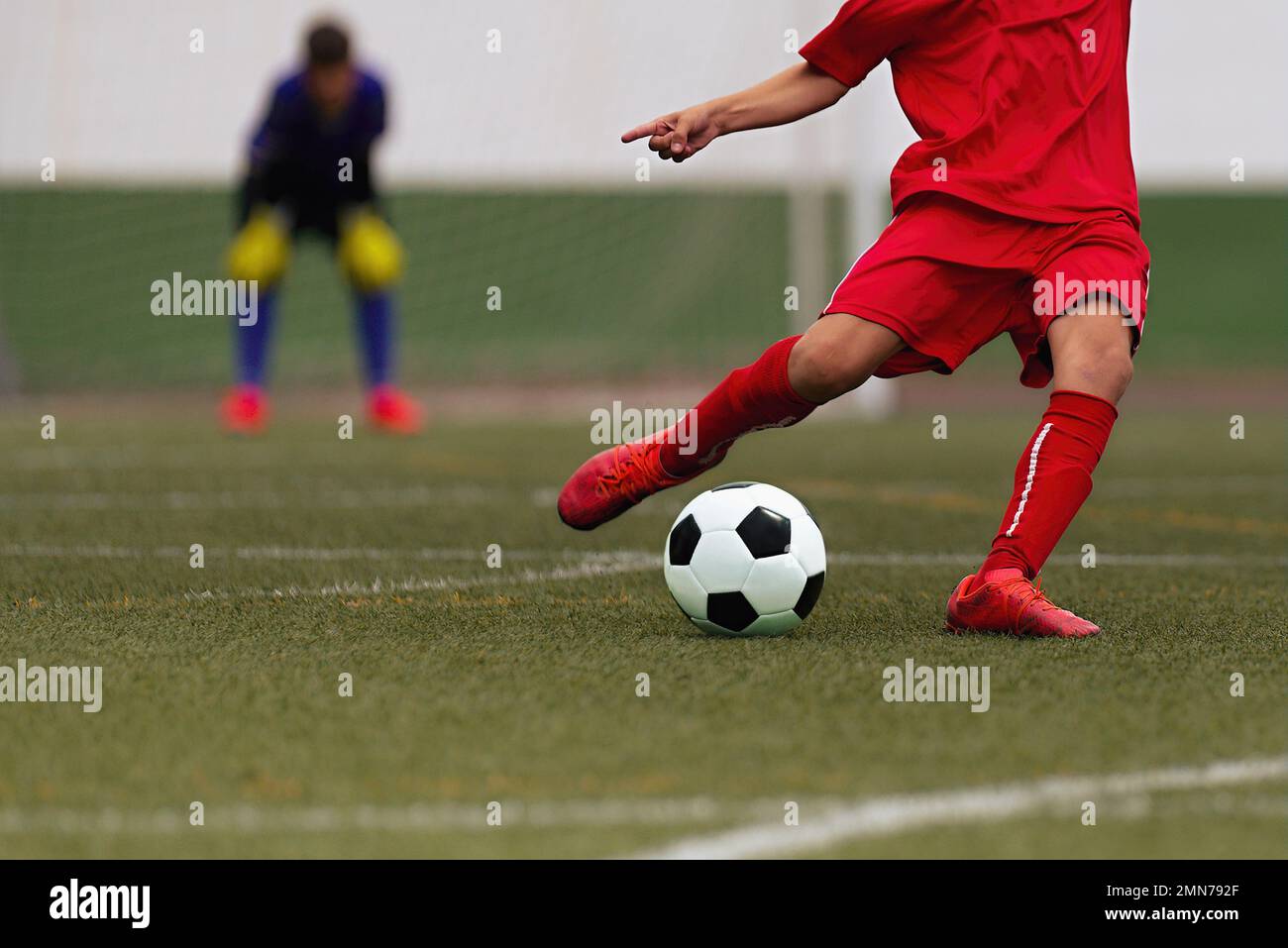 Kids playing soccer tournament game, kicking football on the sports