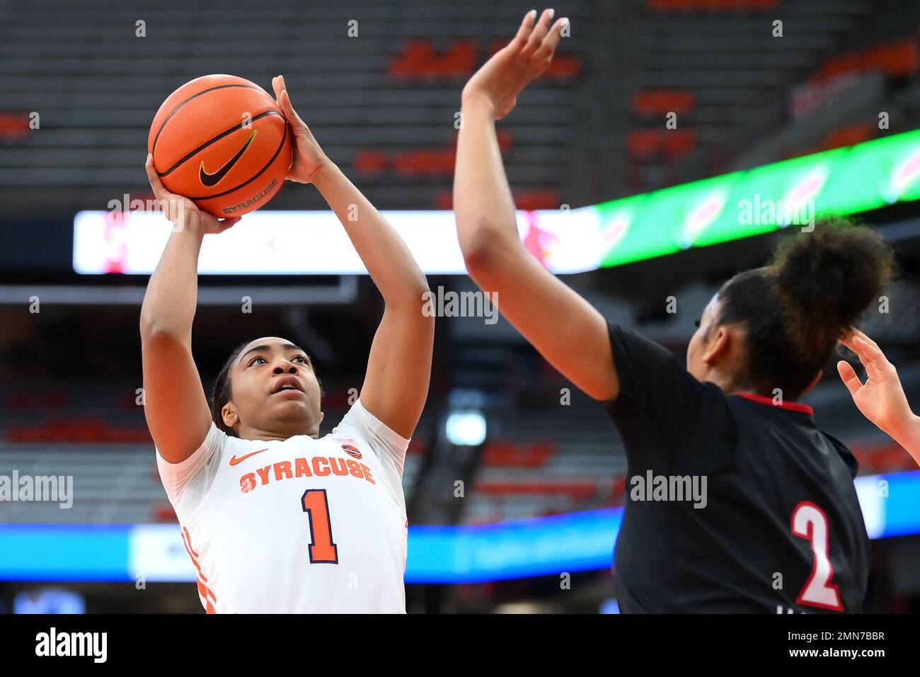 January 29, 2023: Syracuse Orange guard Kennedi Perkins (1) shoots the ball against the defense of Louisville Cardinals forward Nyla Harris (2) during the first half of an NCAA WomenÕs basketball game on Sunday Jan. 29, 2023 at the JMA Wireless Dome in Syracuse, New York. Rich Barnes/CSM Stock Photo