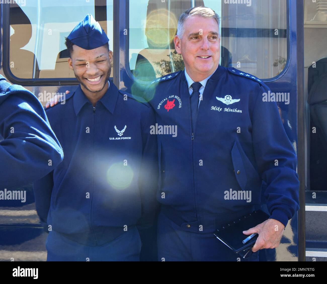 U.S. Air Force Gen. Mike Minihan, commander of Air Mobility Command, greets Senior Airman Samuel McKinney, 316th Logistics Readiness Squadron ground transportation operator, at Joint Base Andrews, Md., September 29, 2022. During his trip, Minihan met with 89th Airlift Wing squadron commanders to provide senior leader perspective mentorship and conversed with enlisted Airmen, some of whom were inspired to join the military because of him. Stock Photo