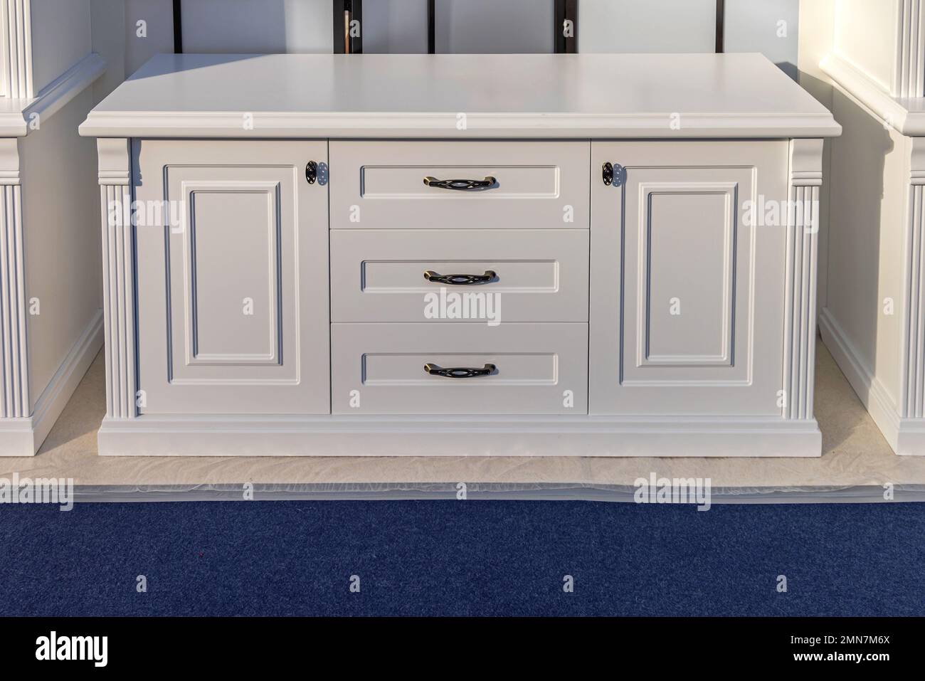 Classic Style White Cabinet With Drawers in Living Room Stock Photo - Alamy