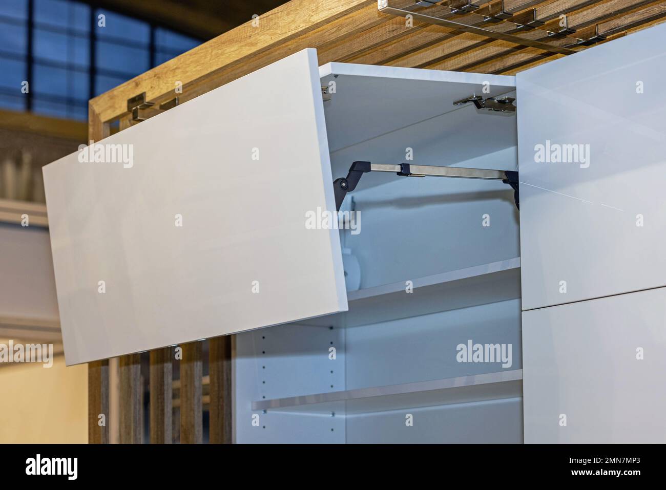 Electric Powered Automatic Door Opener in Modern Kitchen Stock