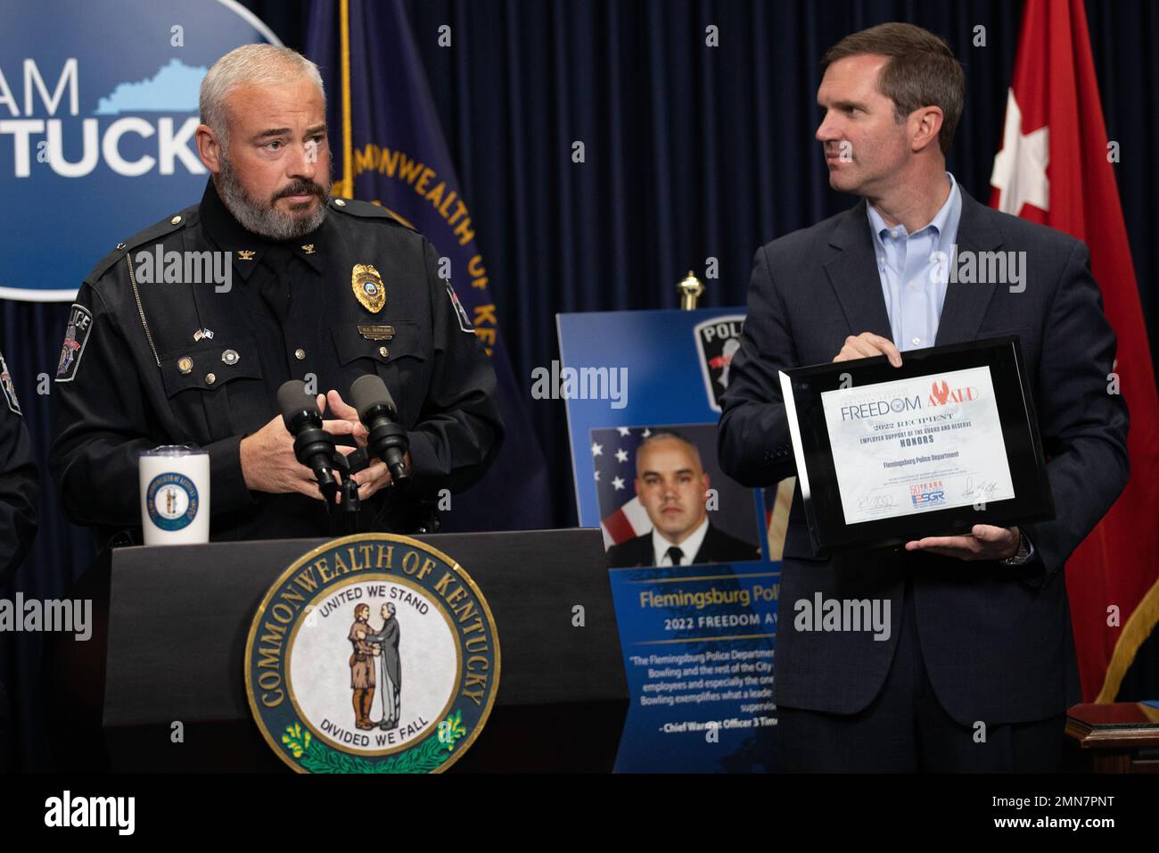 Flemingsburg Police Chief Brian Bowling (left) is presented the Secretary of Defense Freedom Award by Kentucky Governor Andy Beshear (right) at the Kentucky State Capitol in Frankfort, Ky. on Sept. 29, 2022. The Freedom Award is given to civilian employers of the Guard and Reserves by the ESGR for exceptional commitment to servicemembers' military careers. Stock Photo