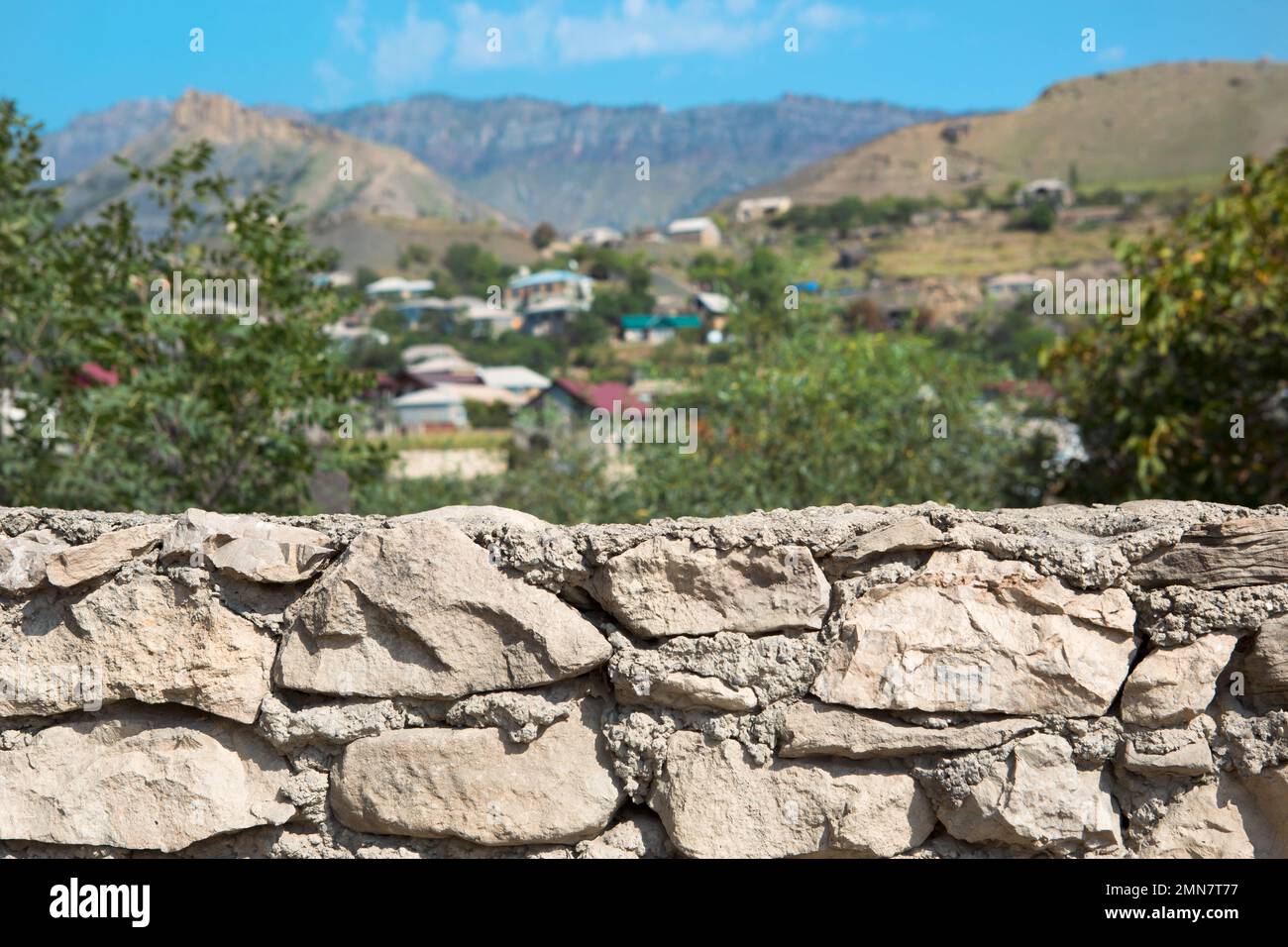 View of Masonry stone walls of natural foreground with background of a mountain ...