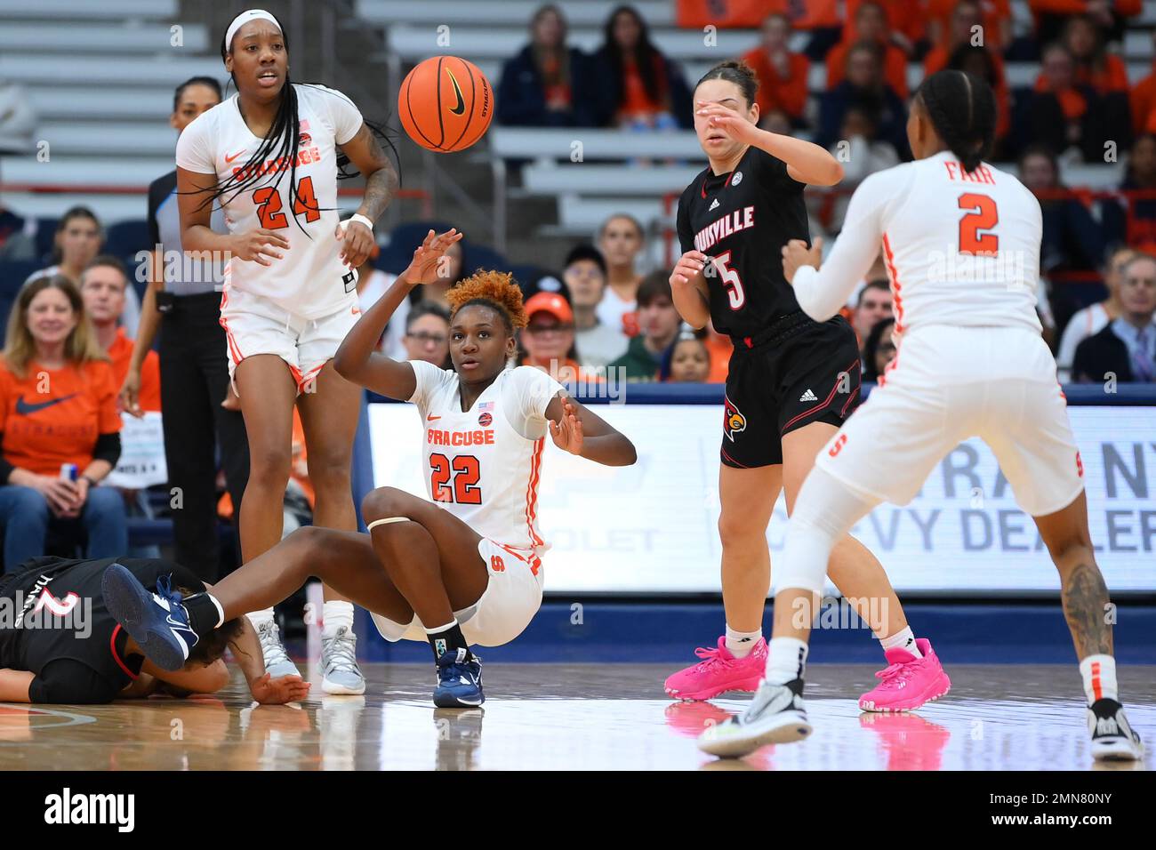 January 29, 2023: Syracuse Orange forward Kyra Wood (22) passes the ball while falling to the court against the Louisville Cardinals during the second half of an NCAA WomenÕs basketball game on Sunday Jan. 29, 2023 at the JMA Wireless Dome in Syracuse, New York. Louisville won 79-67. Rich Barnes/CSM Stock Photo