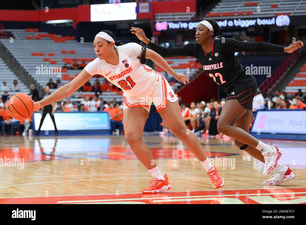 January 29, 2023: Syracuse Orange forward Saniaa Wilson (21) reaches for a loose ball as Louisville Cardinals forward Liz Dixon (22) defends during the second half of an NCAA WomenÕs basketball game on Sunday Jan. 29, 2023 at the JMA Wireless Dome in Syracuse, New York. Louisville won 79-67. Rich Barnes/CSM Stock Photo