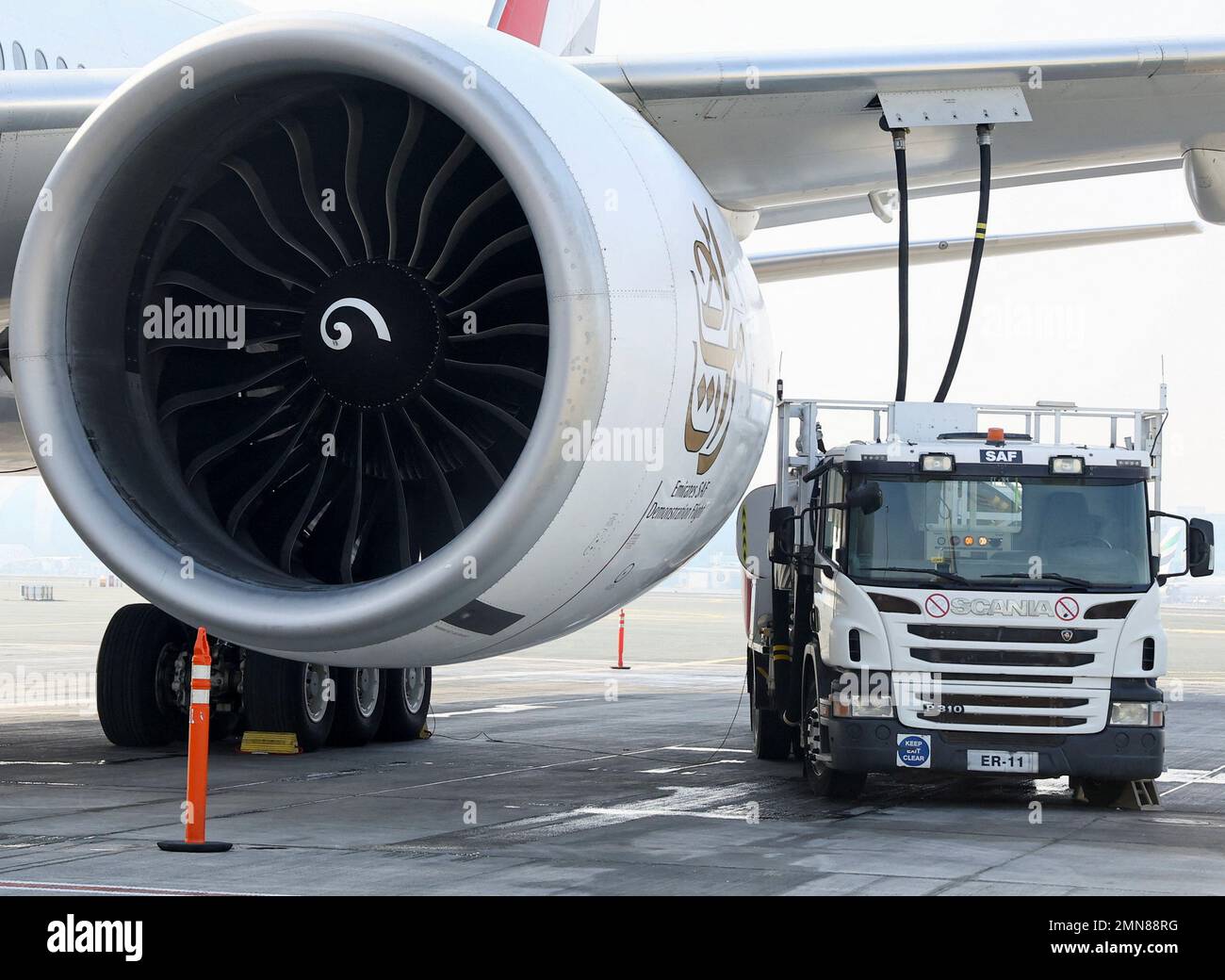 A fuel truck fills up the Emirates Airlines Boeing 777300ER with