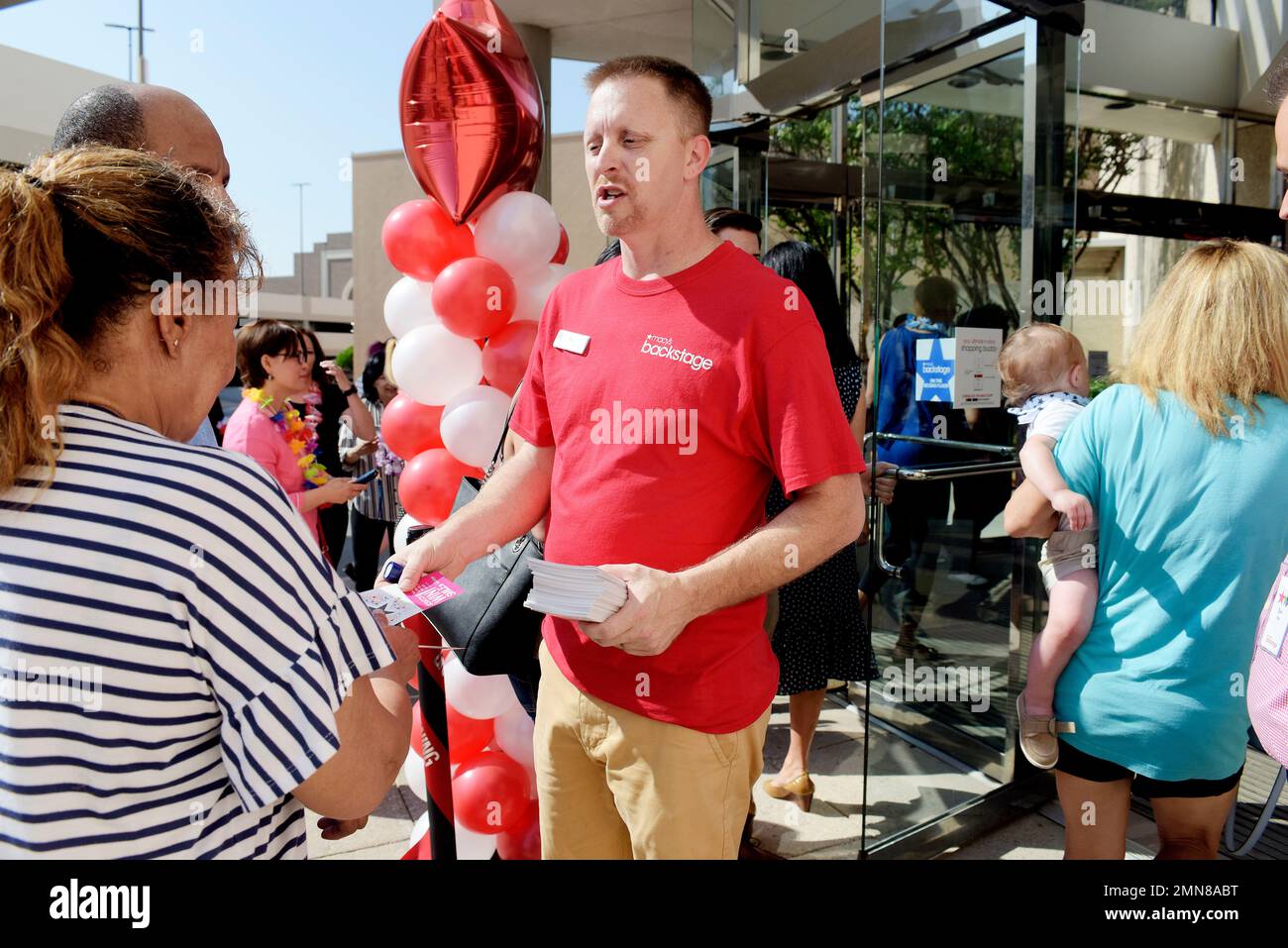 IMAGES DISTRIBUTED FOR MACY'S Macy's employee Roy England hands out