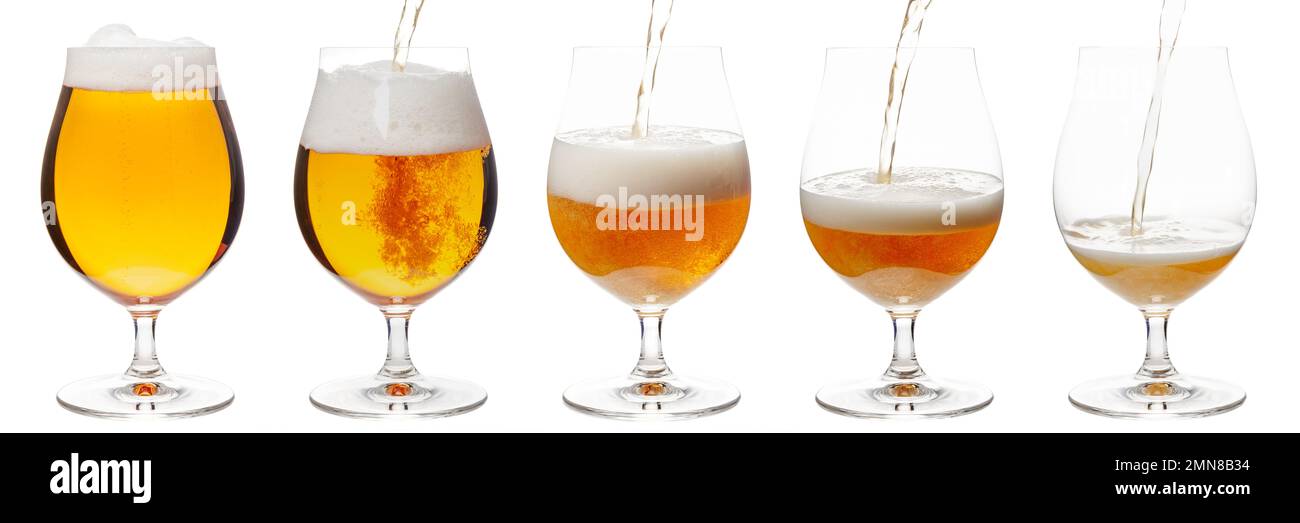 Lager of pilsner beer is pouring into snifter glass isolated on a white