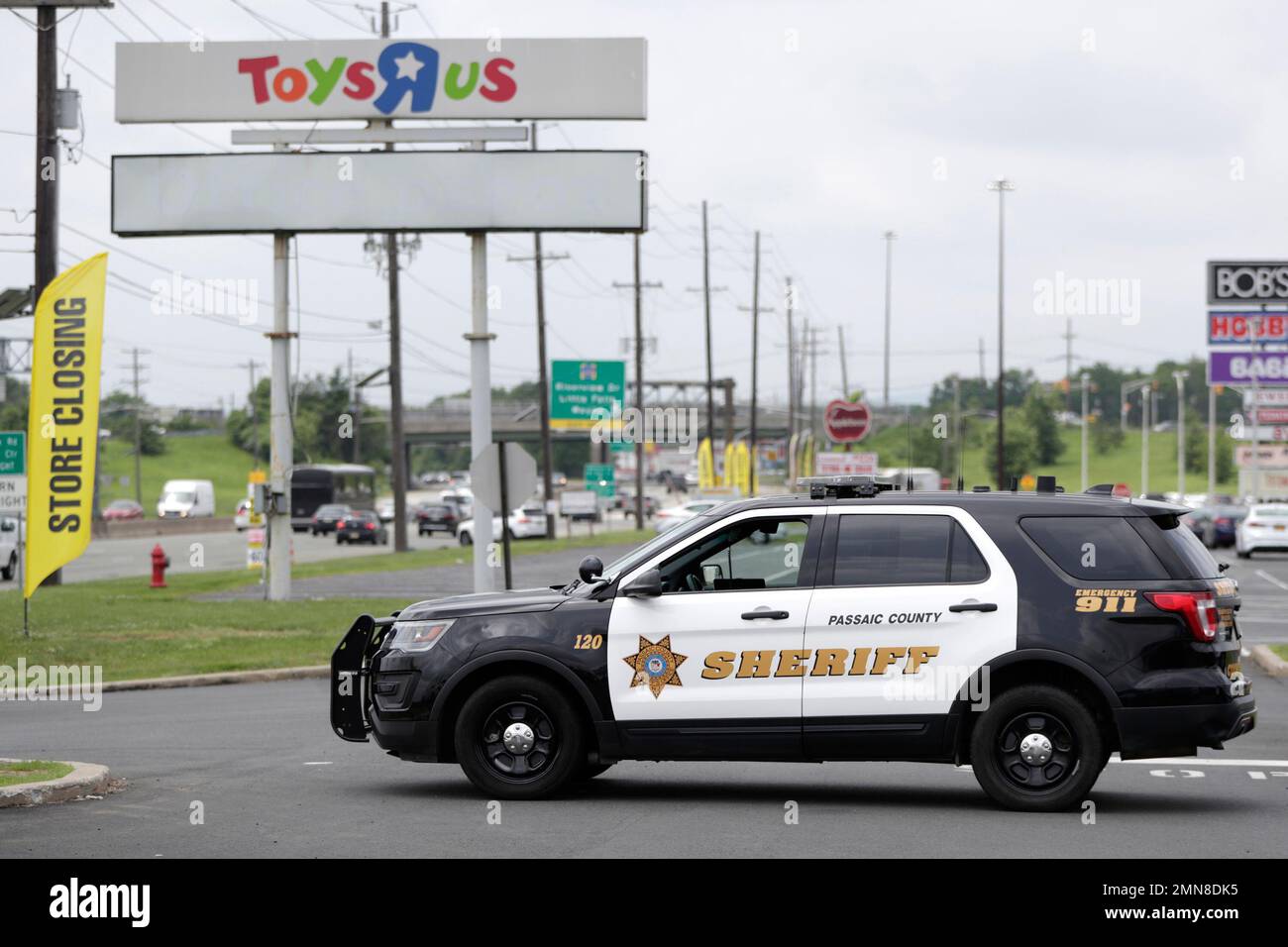 A Passaic County Sheriff's vehicle is seen parked outside of a Toys R