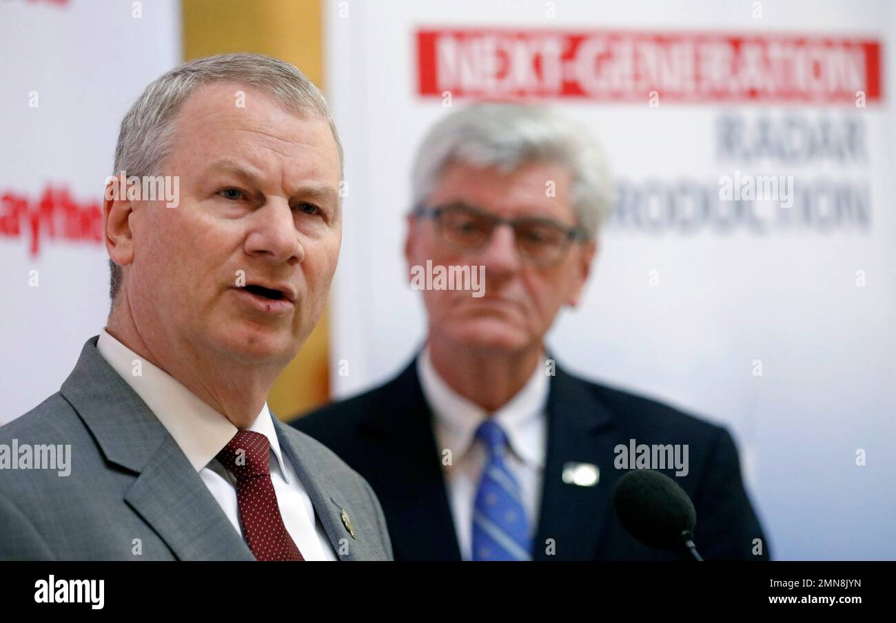 Mississippi Gov. Phil Bryant, right, listens as Wes Kramer, president