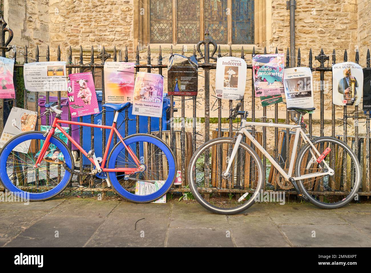 Cycles chained to the railing of St Mary's, the university church at Cambridge, England. Stock Photo