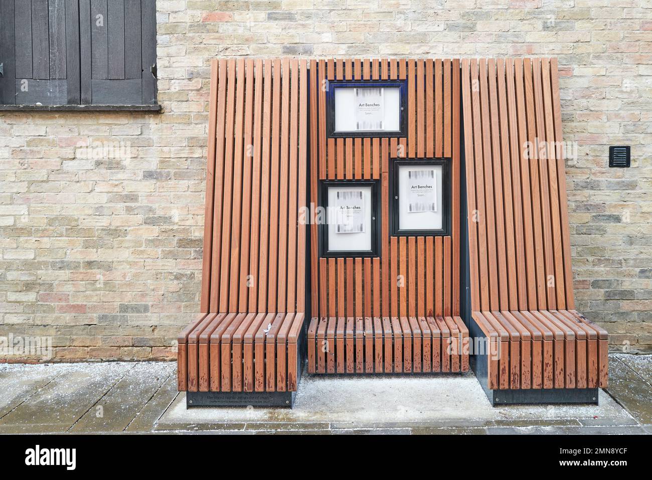 Art bench on a pavement at Cambrridge, England. Stock Photo