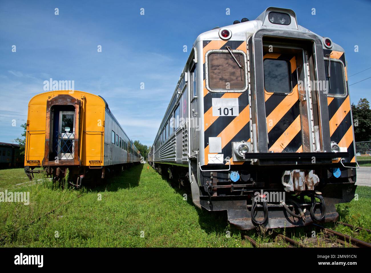 The passenger train is parked on the railway track Stock Photo Alamy