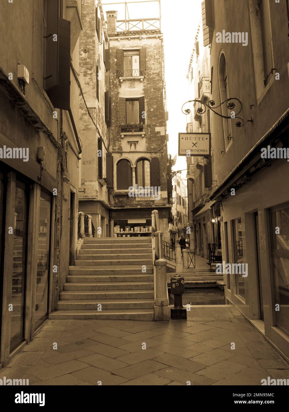 Sepia colored photo of the streets of Venice, Italy. Tourism concept. Stock Photo