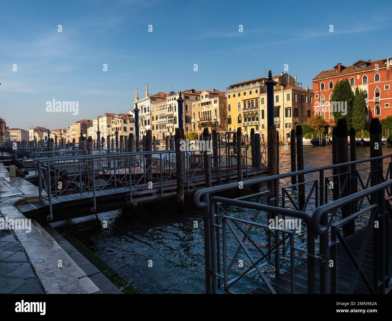 Pier on the grand canal in Venice, Italy. Tourism and transport concept. Stock Photo