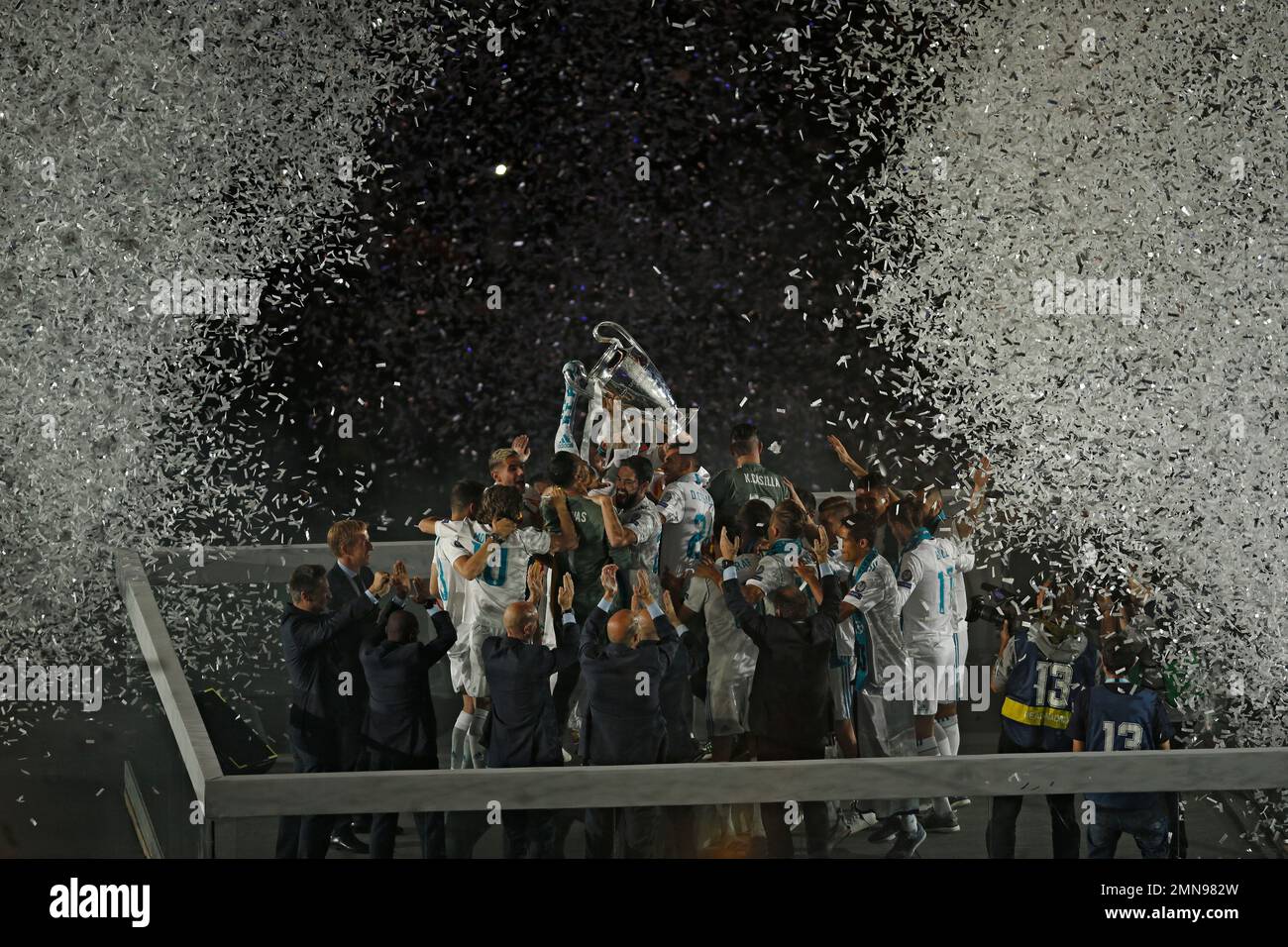 Real Madrid players celebrate with their trophy after winning the ...