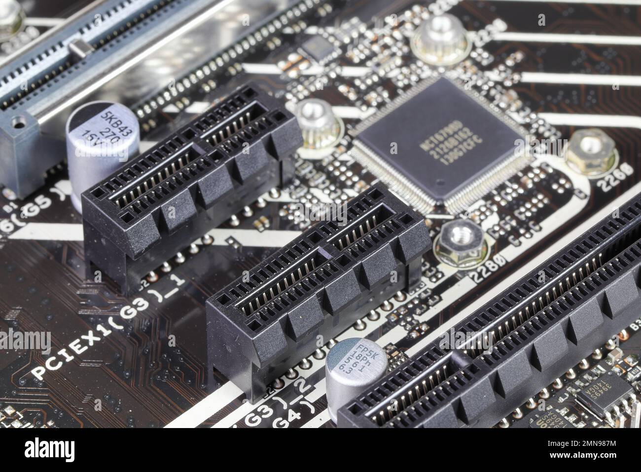 close-up Computer mainboard with pcie x1 and x16 slot on computer mainboard Stock Photo