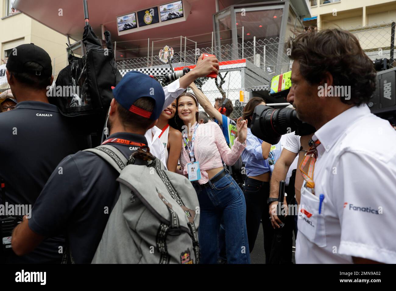 Model Bella Hadid, center, takes a selfie ahead of the Formula One race ...