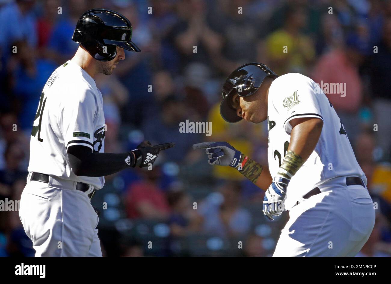 Milwaukee Brewers' Jesús Aguilar, right, gestures after hitting a double  during the seventh inning of a baseball game against the New York Mets,  Sunday, May 5, 2019, in Milwaukee. (AP Photo/Aaron Gash