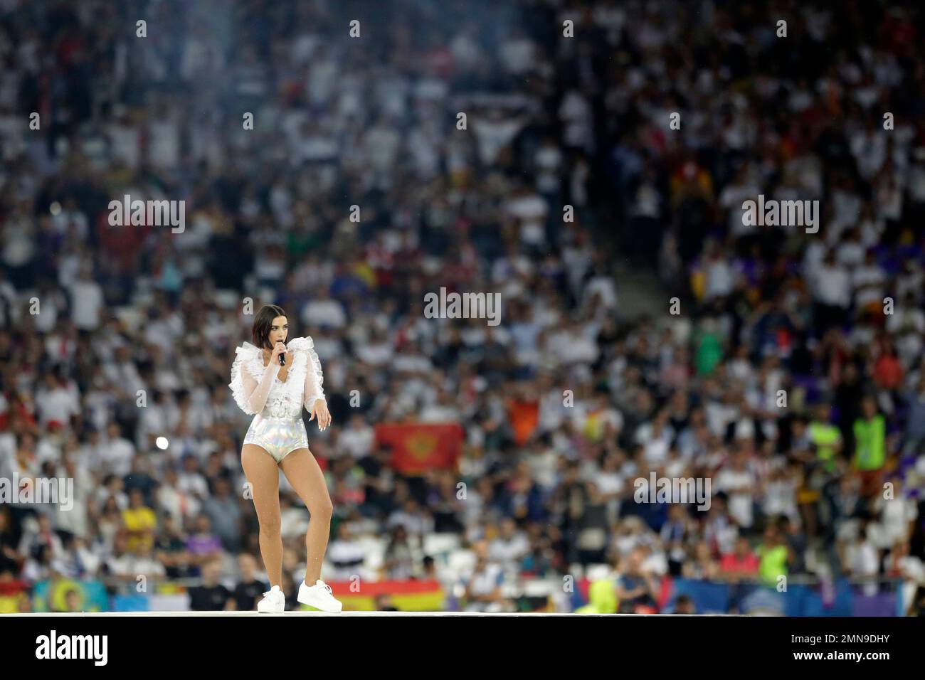Singer Dua Lipa performs ahead of the Champions League Final soccer match  between Real Madrid and Liverpool at the Olimpiyskiy Stadium in Kiev,  Ukraine, Saturday, May 26, 2018. (AP Photo/Matthias Schrader Stock